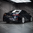 High-gloss black SuperAutoUSA VTEN rear diffuser providing contrast on a Phytonic Blue BMW 5 Series G60