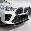 High-gloss black SuperAutoUSA front lip creating a sharp dynamic contrast on a Fire Red Metallic BMW X2