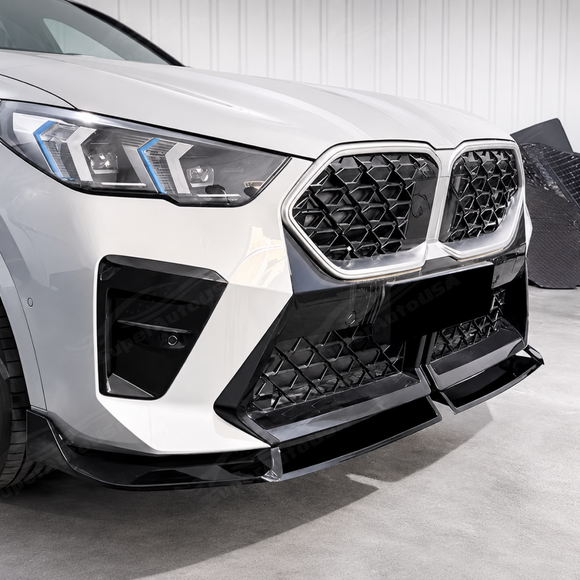 High-gloss black SuperAutoUSA front lip creating a sharp dynamic contrast on a Fire Red Metallic BMW X2
