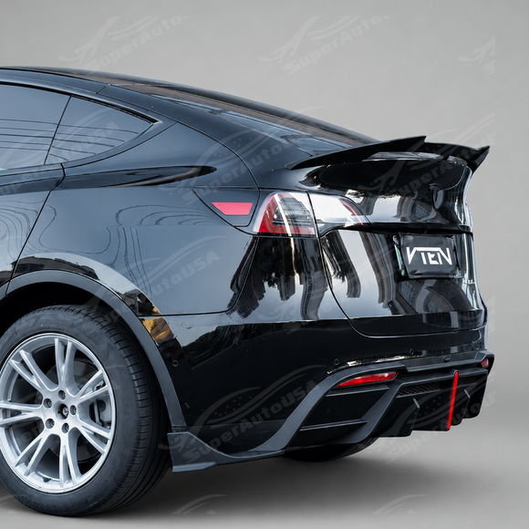 High-gloss black SuperAutoUSA VTEN rear diffuser providing sharp lower contrast on a Pearl White Tesla Model Y