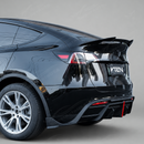 High-gloss black SuperAutoUSA VTEN spoiler providing a sharp contrast on a Pearl White Multi-Coat Tesla Model Y