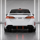 Track-focused stance of the SuperAutoUSA VTEN gloss black spoiler accenting an Alpine White 2025 BMW G60
