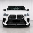 High-contrast visual transformation of the SuperAutoUSA gloss black lip on an Alpine White 2025 BMW X2