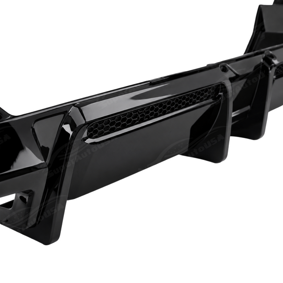 Detailed close-up of the mirror-finish gloss black clear coat on the SuperAutoUSA rear bumper diffuser