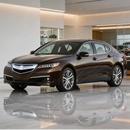 Acura TLX with new SuperAutoUSA silver grille parked in a professional detailing studio