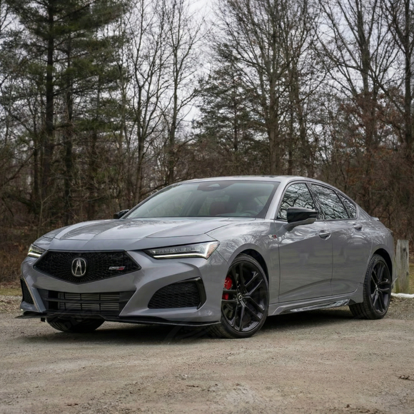 Direct front view of the genuine carbon fiber front bumper splitter for the 2nd Gen Acura TLX