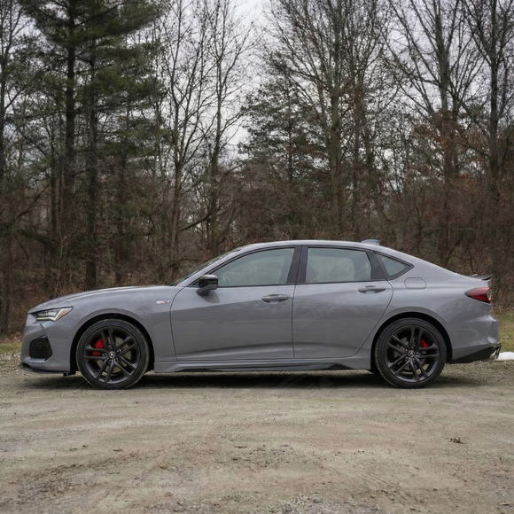 Close-up of the aerodynamic winglet on the real carbon fiber side skirts for Acura TLX