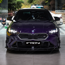 Profile view highlighting the subtle outer side winglet transition on the F74 front lip corner