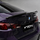 Close-up showing the precision fitment of the wing bases along the F74 trunk lid contours