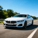 Direct front-facing view of the SuperAutoUSA aerodynamic gloss black splitter for 2018-2026 BMW 8 Series