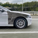 Uninstalled real carbon fiber M style front side vented fender panel, top view