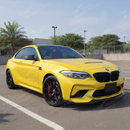 CS Style carbon fiber bumper cover integrated on a black BMW F87 M2