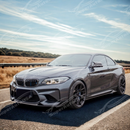 Front lip kit integrated on a black BMW F87 M2