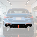 SuperAutoUSA gloss black rear diffuser with integrated LED brake light on a 2021 BMW G22 4 Series