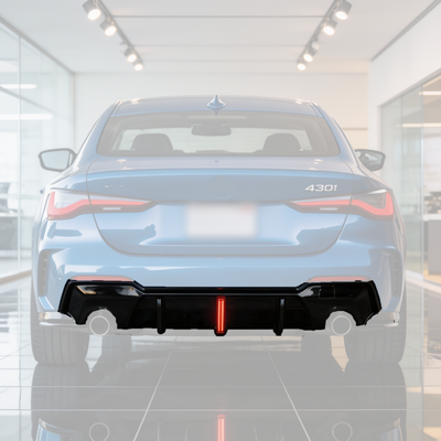 SuperAutoUSA gloss black rear diffuser with integrated LED brake light on a 2021 BMW G22 4 Series