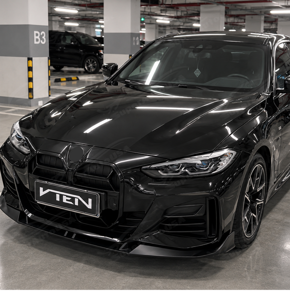 High-contrast styling of the SuperAutoUSA deep gloss black front splitter mounted on an Alpine White BMW G26