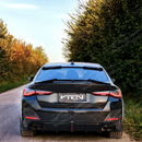 Full rear view of a BMW G26 with VTEN dual exhaust diffuser, LED, and splitters