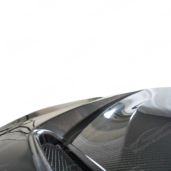 Carbon fiber hood integrated on a black BMW G42 2 Series