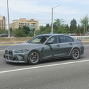 BMW G80 M3 in showroom with MP style front lip kit