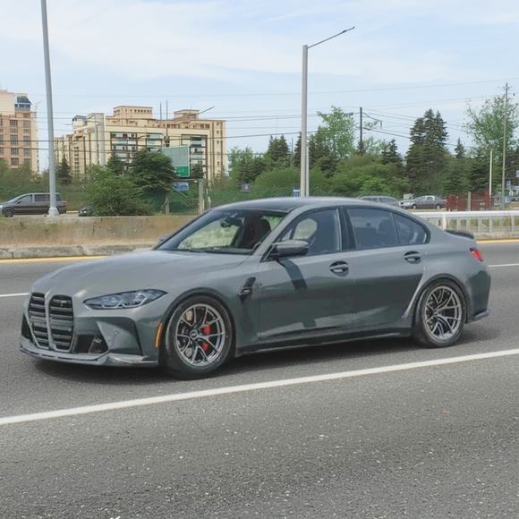 BMW G80 M3 in showroom with MP style front lip kit