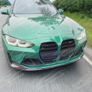 Studio shot highlighting MP style front bumper lower lip spoiler kit on BMW G80 M3
