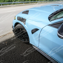 Dynamic shot of BMW G83 M4 with new SuperAutoUSA vented fenders in garage