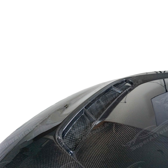 AP style carbon fiber engine hood on a white BMW G87 M2