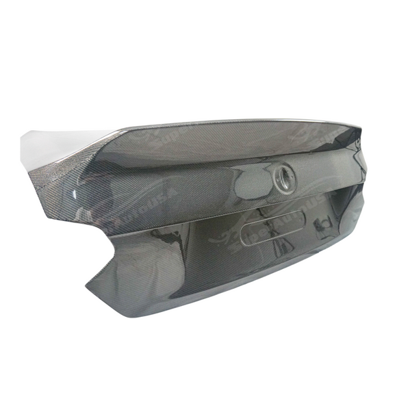 Sleek carbon fiber rear trunk cover installed on a BMW G87 M2