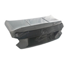  Underside view of uninstalled carbon fiber trunk cover showing mounting points