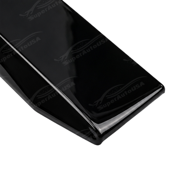 Track-level shot showing the dual-tier front canard layout on the G87 bumper corners