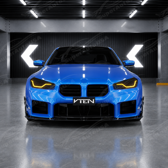 Gloss black SuperAutoUSA VTEN front canards providing sharp contrast on a Zandvoort Blue BMW M2