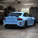 Aggressive lower aero profile of the VTEN gloss black side skirts accenting a Toronto Red BMW M2