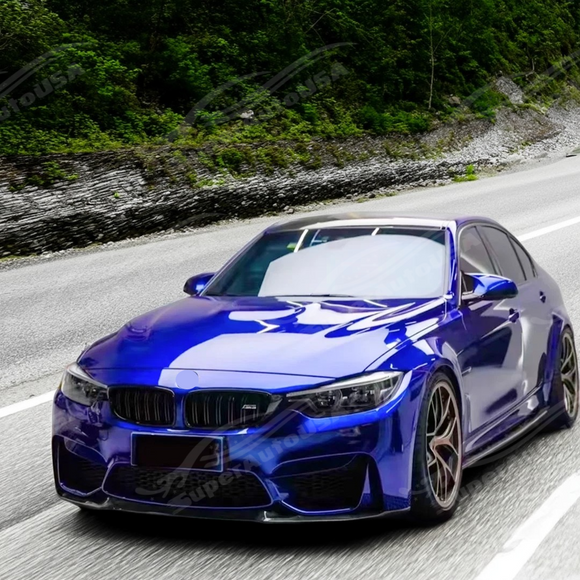 Blue BMW car on a road with greenery in the background