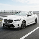 Direct front-facing view of the SuperAutoUSA aerodynamic gloss black splitter for 2024-2026 BMW M5