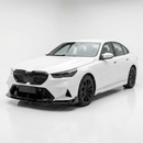 Full 3/4 view of a 2025 BMW M5 featuring the SuperAutoUSA gloss black front lip kit