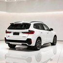 Gloss black roof spoiler providing sharp contrast on an Alpine White BMW X1 U11