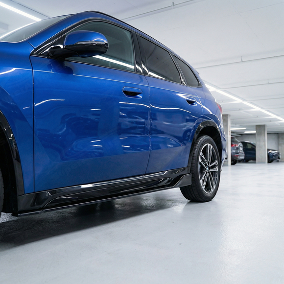 Direct side profile of the gloss black rocker panel extensions for 2023-2025 BMW X1
