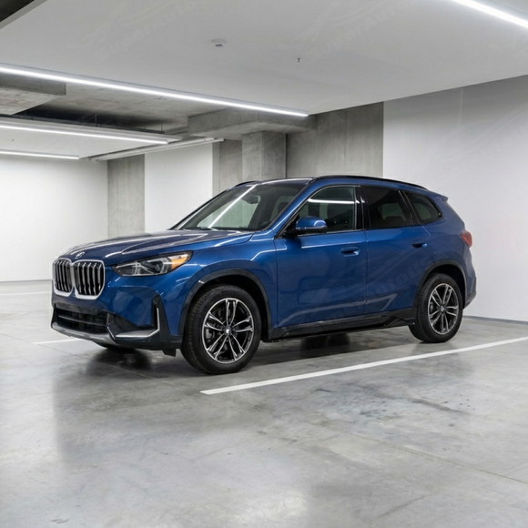 Full 3/4 view of a 2024 BMW X1 xDrive28i with gloss black side skirt under spoilers
