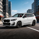 BMW X1 U11 with new SuperAutoUSA carbon fiber print front lip parked in a detailing studio