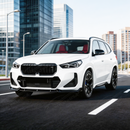2024 BMW X1 in motion highlighting the aerodynamic profile of the SuperAutoUSA front splitter