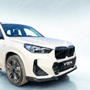 Full front view of a BMW X1 U11 with VTEN front lip kit