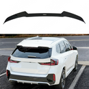 Black car spoiler on a white car with a road background VTEN gloss black rear roof spoiler on a BMW X1 U11