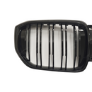 High-impact front view of a 2025 BMW X5 featuring the SuperAutoUSA gloss black grille upgrade