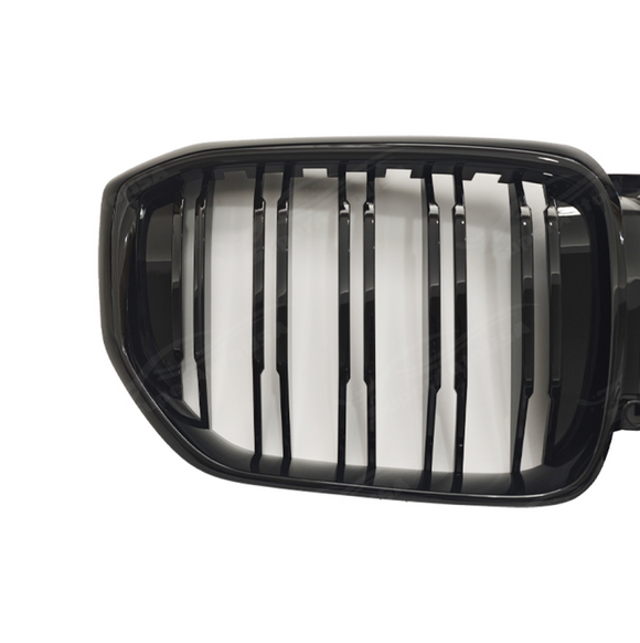 High-impact front view of a 2025 BMW X5 featuring the SuperAutoUSA gloss black grille upgrade