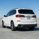 BMW X5 with new SuperAutoUSA real carbon fiber rear diffuser parked in a professional shop