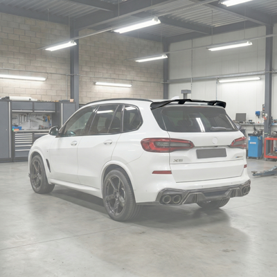 SuperAutoUSA double-sided real carbon fiber rear roof spoiler wing installed on a 2019 BMW X5 G05