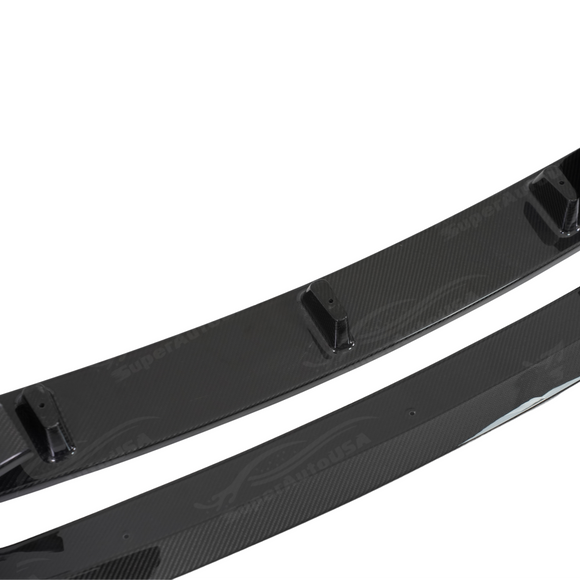 Professional studio photography highlighting the deep carbon weave of the SuperAutoUSA front lip