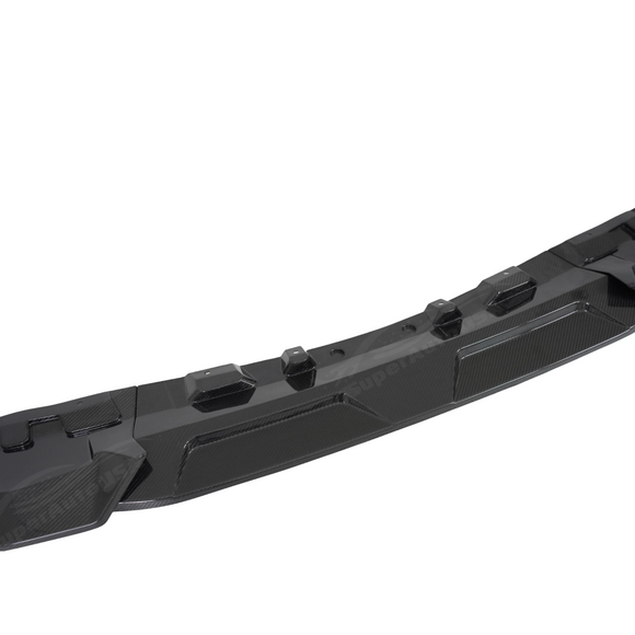 Detailed profile of the aerodynamic fins on the double-tier BMW X7 carbon front lip