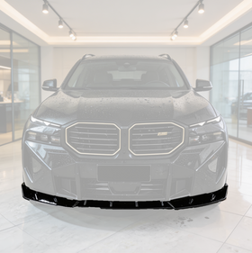SuperAutoUSA gloss black front bumper lip installed on a 2023 BMW XM G09
