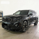 Direct front-facing view of the SuperAutoUSA aerodynamic gloss black splitter for 2023-2026 BMW XM